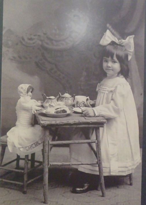 Antique Photo girl with big hair bow toy tea with bisque doll