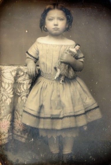 antique-photo-1850s-girl-by-blanket-with-china-doll